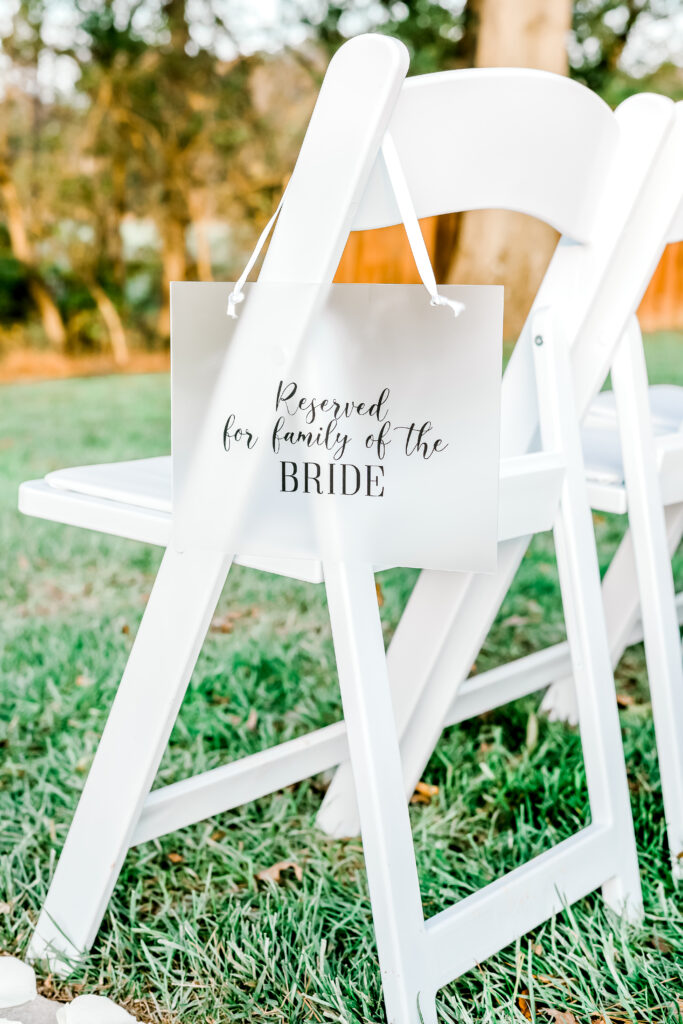 Reserved for family of the bride poster on chairs.