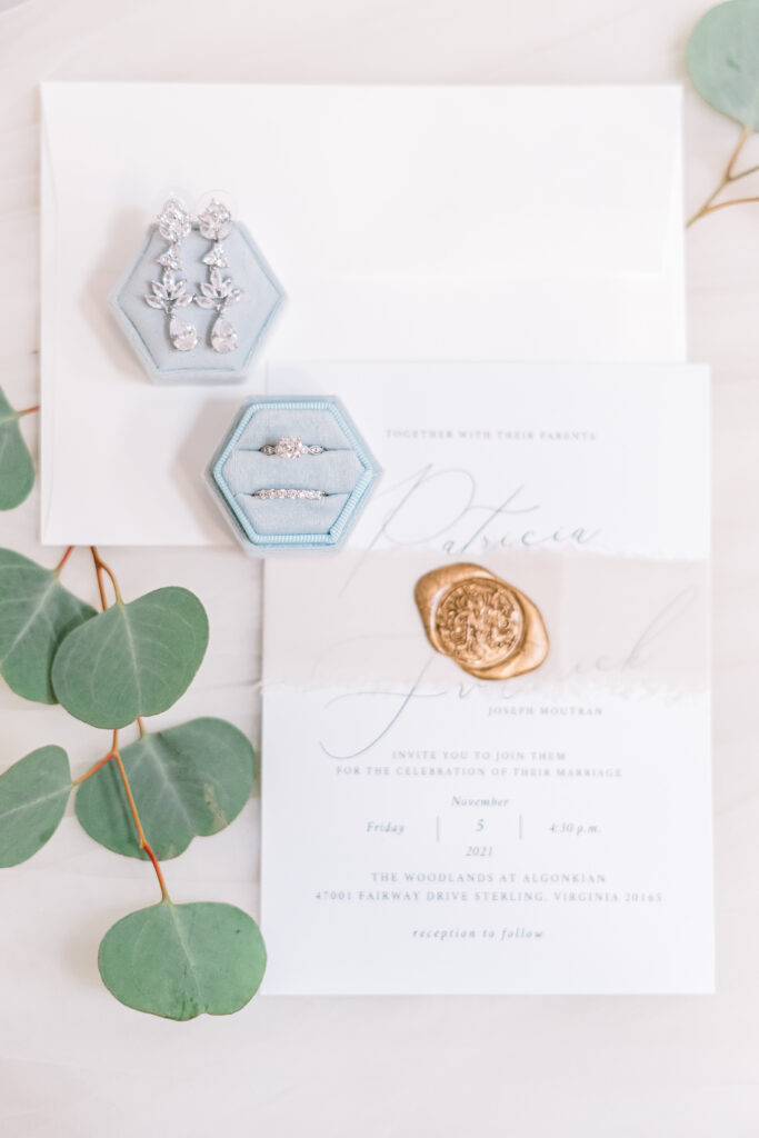 Wedding details, wedding ring, wedding invitation.